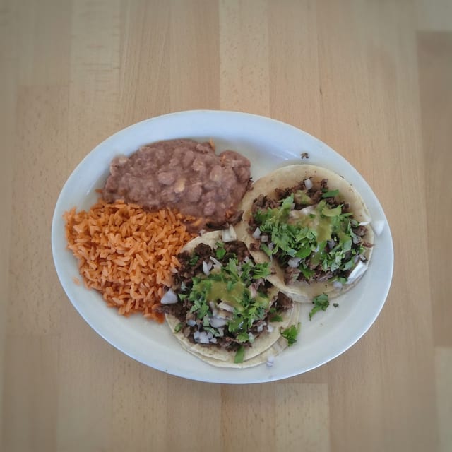 Taco Plate Special 2 Tacos, Rice, Beans & Drink.